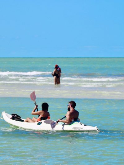 a man riding a surfboard in the ocean