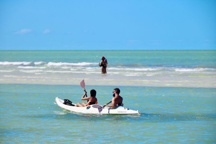 a man riding a surfboard in the ocean